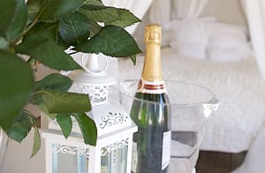 Champagne on ice in honeymoon Arabian tent at Harvest Moon Weddings