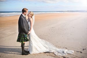 Newlywed couple at beach wedding