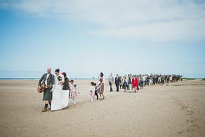 Wedding party on beach in Scotland