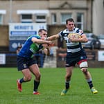 Heriots Ross Jones fends off Boroughmuirs Callum Ramm. FOSROC Super 6 match between Heriot's Rugby and Boroughmuir Bears at Goldenacre, Edinburgh on 09/10/2021. 

(Photo: 39 Design Photography)