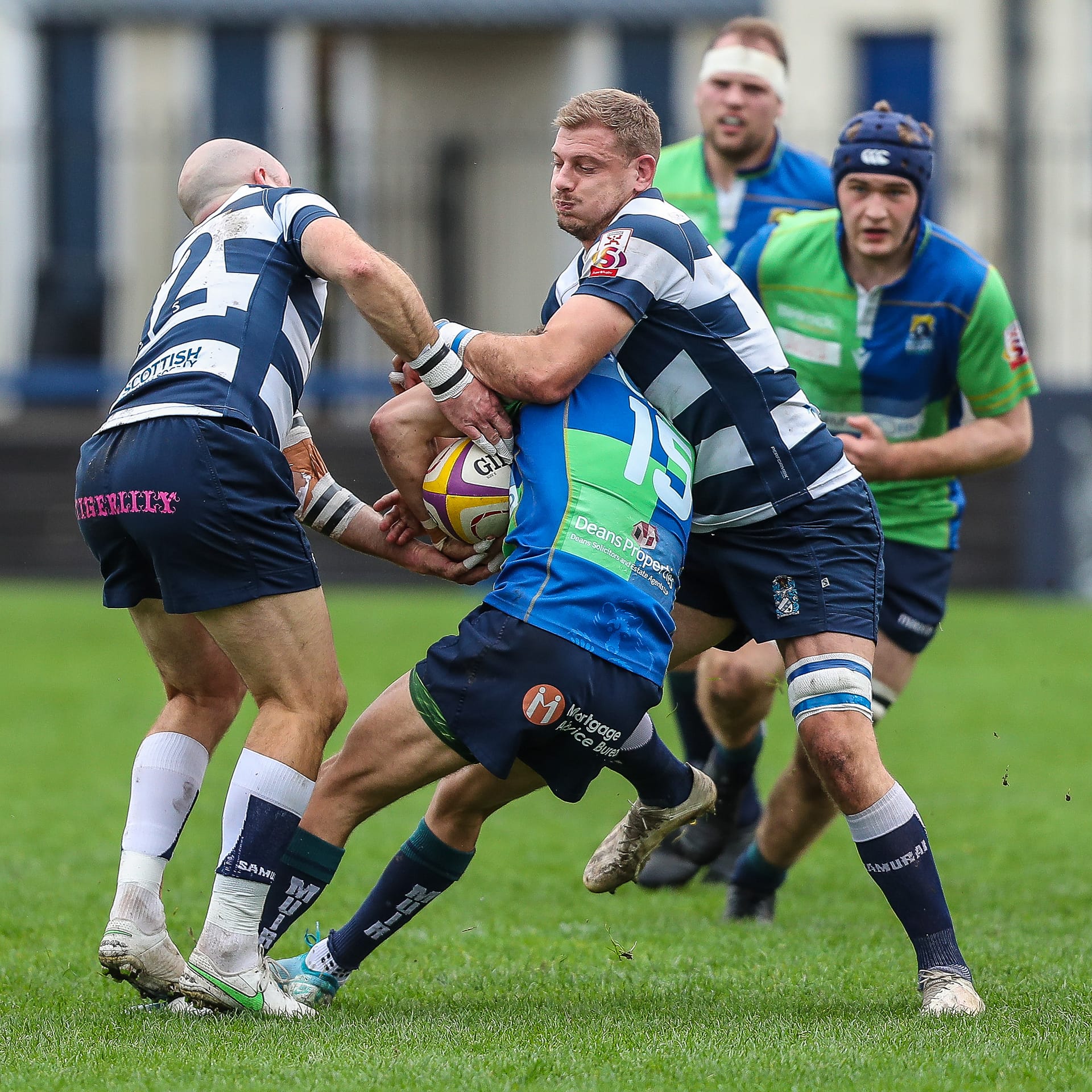 Heriots Jason Hill and Iain Wilson tackle Boroughmuirs Tom Brown during the FOSROC Super 6 match between Heriot's Rugby and Boroughmuir Bears at Goldenacre, Edinburgh on 09/10/2021. 

(Photo: 39 Design Photography)